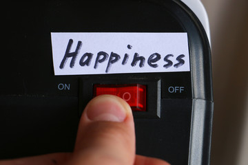 having fun concept. finger presses a button and turns on happiness