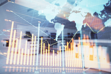 Stock and bond market graph and world map with trading desk bank office interior on background. Multi exposure. Concept of international finance