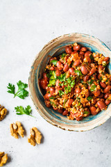 Georgian traditional beans lobio in bowl on a white-gray background.