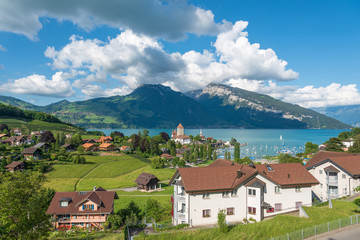 Fototapeta na wymiar Lake Thun with townscape of Spiez