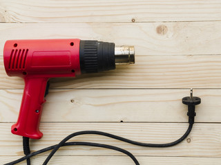 Red gas burner on wooden table