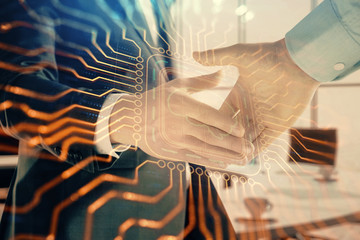Double exposure of brain drawing on office background with two men handshake. Concept of innovation