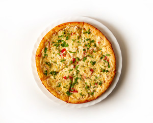 Pizza with chicken, cheese, tomatoes, sprinkled with chopped greens top view