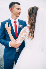 Wedding couple on the sea, lovers on the pier