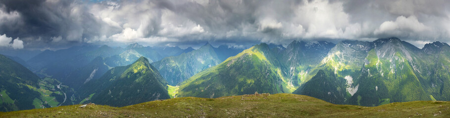 Panoramic view of summer mountains and overcast sky