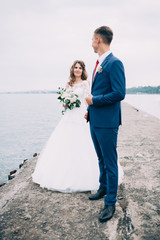 Wedding couple on the sea, lovers on the pier