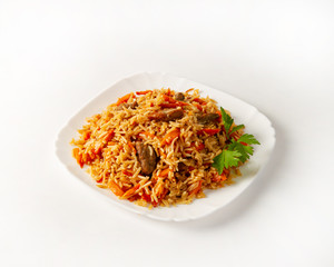 Portion of beef pilaf, decorated with parsley on white background