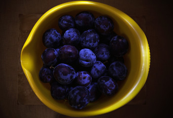 Fresh Plums in Yellow Dish