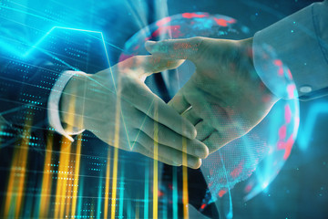 Fototapeta premium Multi exposure of forex graph and world map on abstract background with two businessmen handshake. Concept of success on international markets