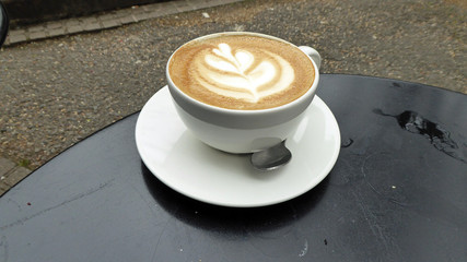 Cup of coffee on a table.