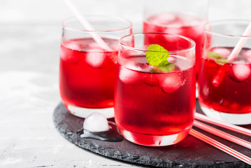 Red alcoholic coctail with ice and mint