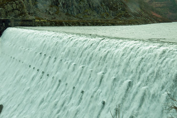 Elan valley dams in full flow during the winter.
