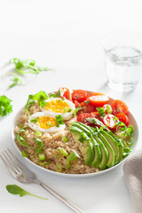 quinoa with boiled egg, avocado, tomato, arugula. healthy breakfast