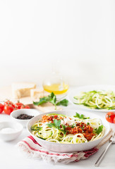 keto paleo zoodles bolognese: zucchini noodles with meat sauce and parmesan