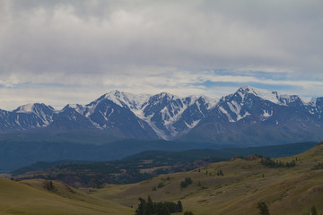 Snow tops in Altai mountains. Summer travel concept. Beautiful landscape.