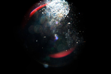 Lens Flare. Light over black background. Easy to add overlay or screen filter over photos. Abstract...