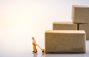 Man using hand-lift dragging boxes on white background