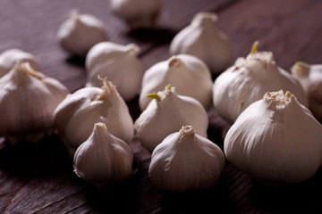 Garlic bulbs on wooden table