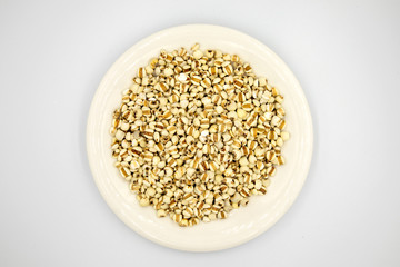 Job’s tears or Millet in a white dish on a white background