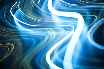 Colorful pattern of blue dynamic neon lines. Modern background. Art concept of lighting effects.