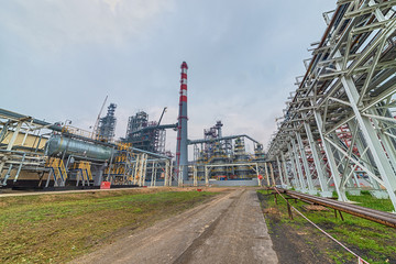 view of the refinery against the cloudy sky