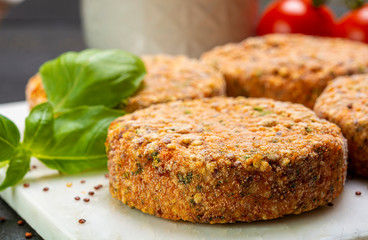 Tasty vegetarian burgers made from healthy quinoa, basil, tomatoes and mozzarella cheese
