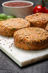 Tasty vegetarian burgers made from healthy quinoa, basil, tomatoes and mozzarella cheese