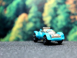 classic toy car on the road