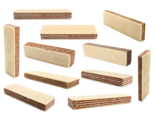 Set of delicious crispy wafers on white background