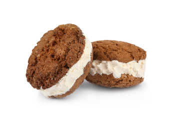 Sweet delicious ice cream cookie sandwiches on white background