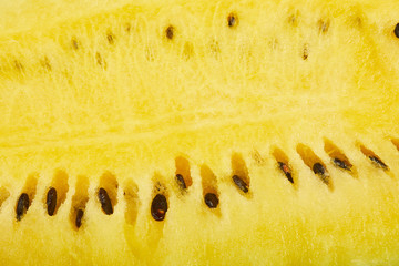 close up view of yellow juicy ripe watermelon with seeds