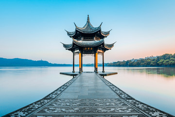 Jixian pavilion during sunrise in Hangzhou, Zhejiang province, China with all Chinese words on it...
