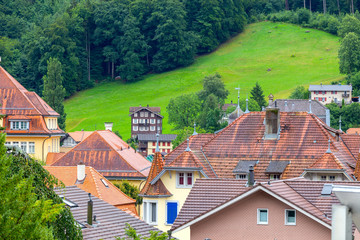 Interlaken. Aerial view of the city rooftops and mountains.