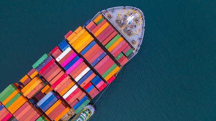 Container ship carrying container aerial view, Business import and export logistic and transportation of international by container ship in the open sea, with copy space. - obrazy, fototapety, plakaty