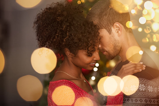 Loving couple embracing with warm lights