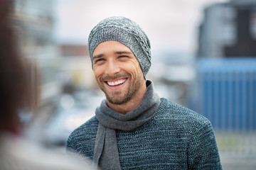 Smiling young man wearing winter clothes