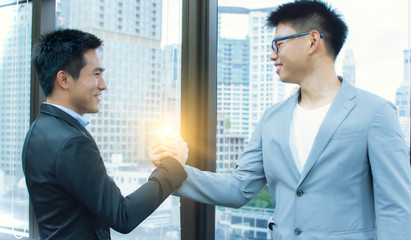 Business men making handshake for business agreement