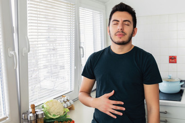 The young man no longer experiences pain and discomfort in the stomach, as he drinks vegetable milk. He has lactose intolerance.