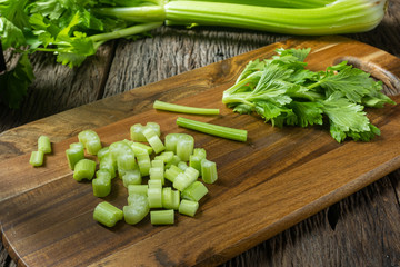  Sliced fresh celery or Celery stalk on cutting wooden board