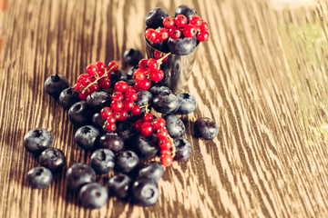 Beautiful fragrant and delicious Cyanococcus berry on a brown background and a beautiful...