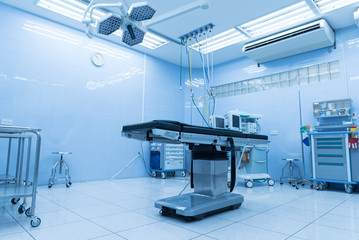 Empty interior operating room and modern equipment in hospital.Medical device for surgeon surgical emergency patient in blue tone style.Save life medical treatment concept.  K