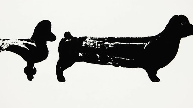 Black silhouettes of dachshund and poodle on the white background, graphic arts