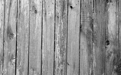 Weathered wooden fence in black and white.