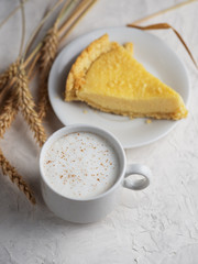 a Cup of coffee latte and homemade cake with cottage cheese
