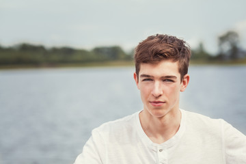 close up of teen boy, Portrait of a handsome young man on a background of nature