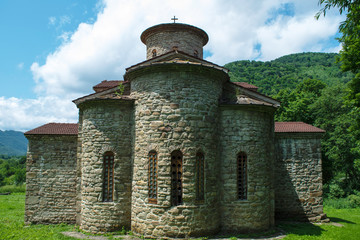 10th century ancient Christian church, Nizhnearhizy temples, Northern Zelenchuk temple, stone temple among mountains and vegetation
