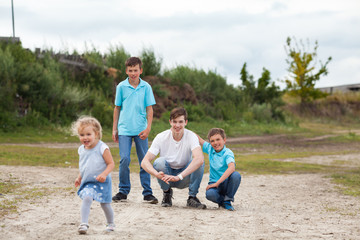 Group of happy cheerful beautiful children running in park, outdoor