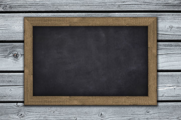 blank  chalkboard on wooden wall background