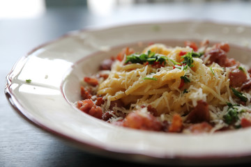 Spaghetti white sauce (Spaghetti Carbonara) with bacon and garlic , on wood table background