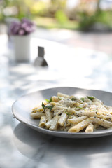 Penne pasta with white sauce and truffle , italian food
